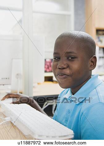 Student sitting at computer View Large Photo Image Stock Image - Student sitting at computer. Fotosearch