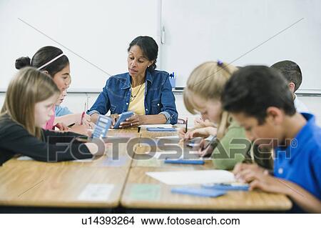 Students doing math work in classroom View Large Photo Image Picture - Students doing math work in classroom. Fotosearch