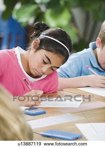 Students doing math work in classroom View Large Photo Image Stock Photo - Students doing math work in classroom. Fotosearch