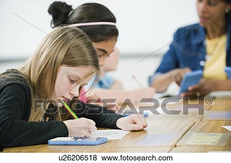 Students doing math work in classroom View Large Photo Image Stock Photo - Students doing math work in classroom. Fotosearch