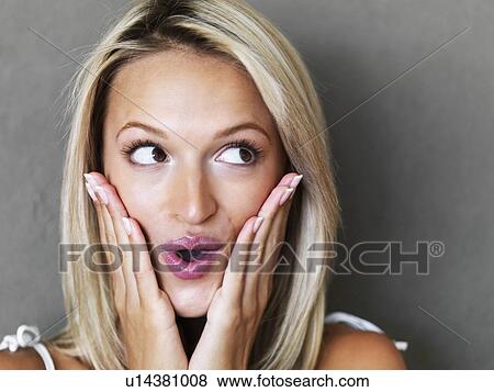 Stock Photo - Surprised blond woman. Fotosearch