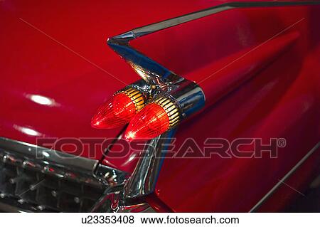 Stock Photo - Tail fin on a 1959 red automobile. Fotosearch