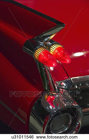 Tail fin on a 1959 red automobile View Large Photo Image Stock Photograph - Tail fin on a 1959 red automobile. Fotosearch