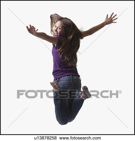 Teenage girl jumping for joy View Large Photo Image Stock Photo - Teenage girl jumping for joy. Fotosearch