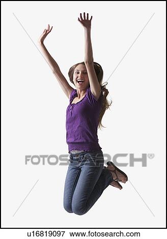 Stock Photo - Teenage girl jumping for joy. Fotosearch