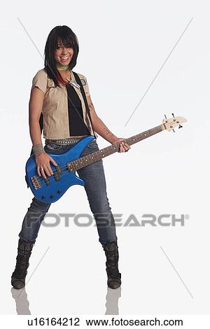 Teenage girl playing electric guitar View Large Photo Image Stock Image - Teenage girl playing electric guitar. Fotosearch