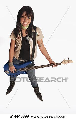 Teenage girl playing electric guitar View Large Photo Image Stock Photo - Teenage girl playing electric guitar. Fotosearch