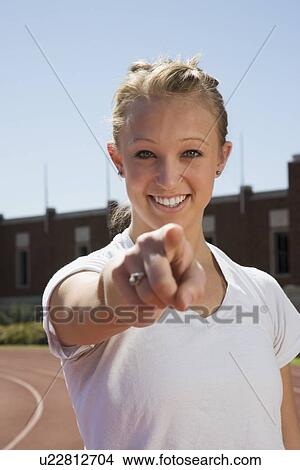 Teenage girl pointing her finger View Large Photo Image Picture - Teenage girl pointing her finger. Fotosearch