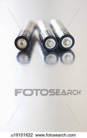 Stock Image - Three double A batteries. Fotosearch