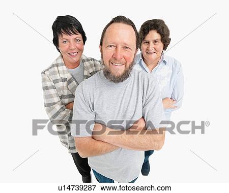 Stock Photo - Three people standing with their arms crossed. Fotosearch