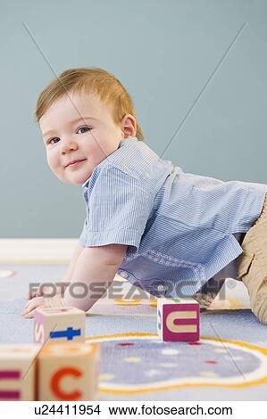 Picture - Toddler playing with blocks. Fotosearch