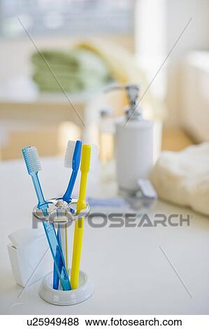 Toothbrushes in toothbrush holder View Large Photo Image Stock Photo - Toothbrushes in toothbrush holder. Fotosearch