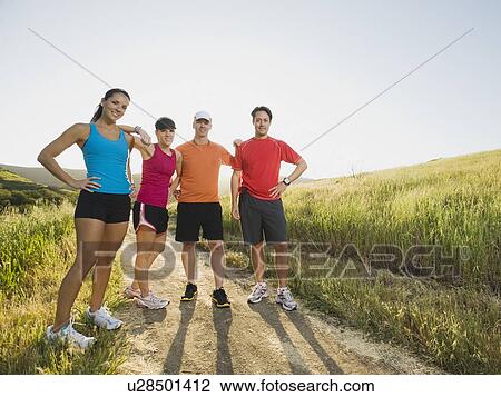 Stock Image - Trail runners taking a break. Fotosearch