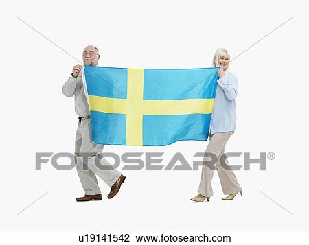 Two people carrying the flag the Swedish flag View Large Photo Image Stock Image - Two people carrying the flag the Swedish flag. Fotosearch