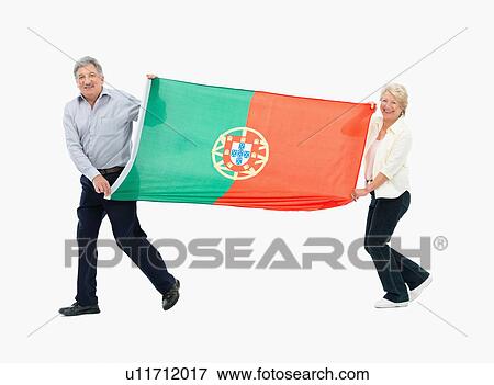 Stock Photo - Two people carrying the Portuguese flag. Fotosearch