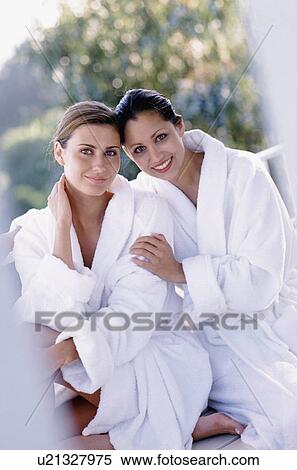 Two woman wearing bath robes View Large Photo Image Stock Photography - Two woman wearing bath robes. Fotosearch