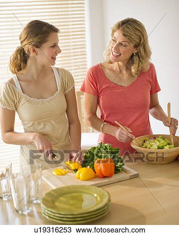 Two women preparing salad View Large Photo Image Stock Image - Two women preparing salad. Fotosearch
