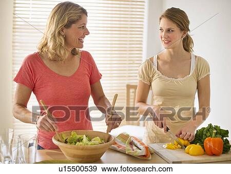 Stock Photo - Two women preparing salad. Fotosearch