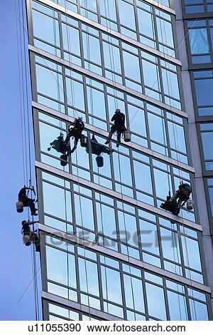 Window washers cleaning windows on skyscraper View Large Photo Image Stock Image - Window washers cleaning windows on skyscraper. Fotosearch