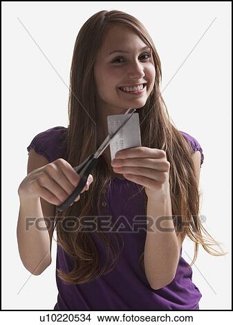 Woman cutting up a credit card View Large Photo Image Picture - Woman cutting up a credit card. Fotosearch