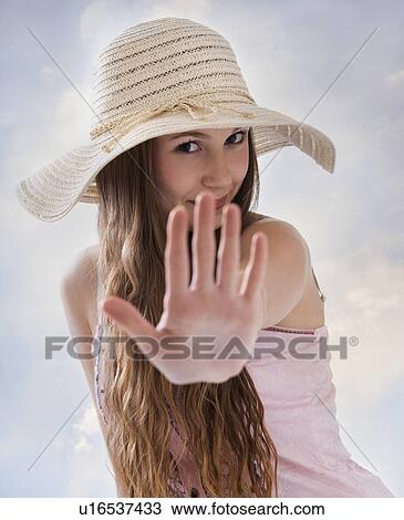 Woman holding her hand out in front of her View Large Photo Image Stock Image - Woman holding her hand out in front of her. Fotosearch