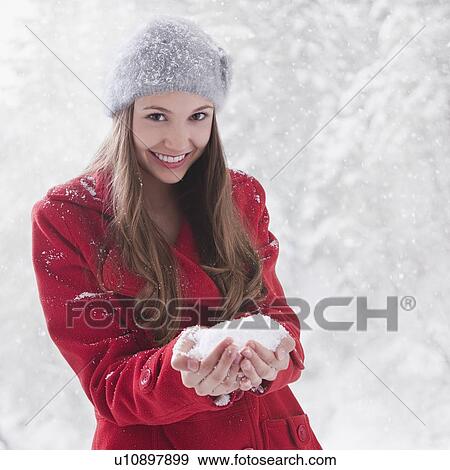 Woman holding snow in her hands View Large Photo Image Stock Photo - Woman holding snow in her hands. Fotosearch