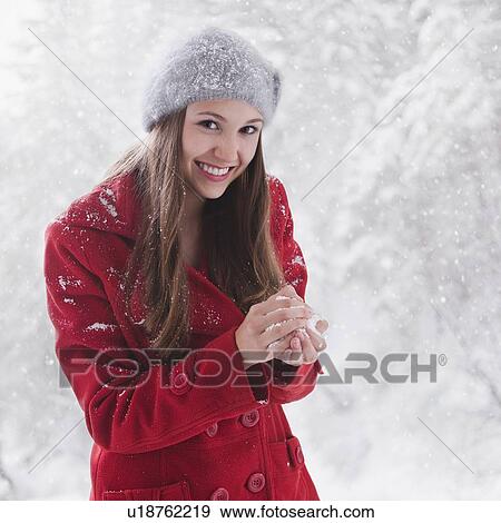 Woman making a snowball View Large Photo Image Stock Photo - Woman making a snowball. Fotosearch