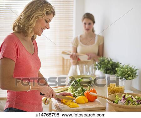 Stock Photo - Woman preparing salad. Fotosearch