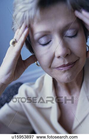 Stock Photo - Woman with a headache. Fotosearch