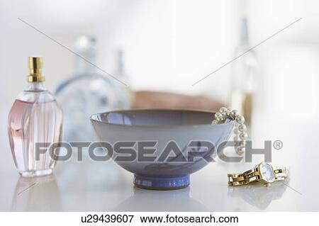 Stock Photo - Woman's items on dresser. Fotosearch