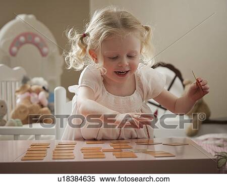 Young girl playing memory game View Large Photo Image Stock Photography - Young girl playing memory game. Fotosearch