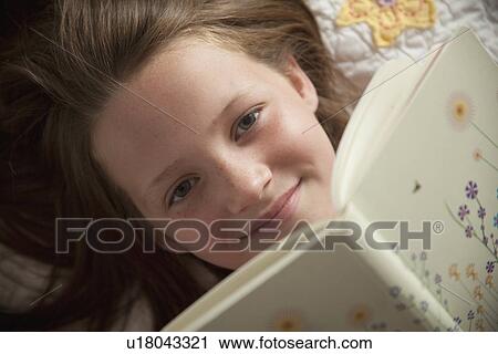 Young girl reading her diary View Large Photo Image Stock Image - Young girl reading her diary. Fotosearch