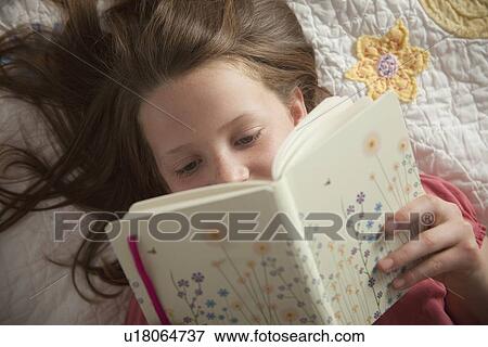 Young girl reading her diary View Large Photo Image Stock Photo - Young girl reading her diary. Fotosearch