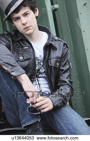 a teenage boy sitting on the back of a train; portland, oregon, united states of america View Large Photo Image Stock Image - a teenage boy sitting on the back of a train; portland, oregon, united states of america. Fotosearch