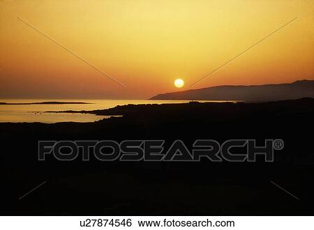 Stock Photograph - Coastal Sunset, Magahrea, County Donegal, Ireland. Fotosearch