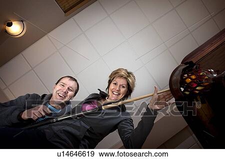 couple playing pool or billiards; edmonton, alberta, canada View Large Photo Image Stock Photo - couple playing pool or billiards; edmonton, alberta, canada. Fotosearch