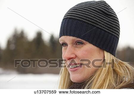 edmonton, alberta, canada; a woman wearing a winter hat View Large Photo Image Stock Photo - edmonton, alberta, canada; a woman wearing a winter hat. Fotosearch