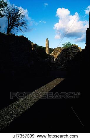 Glendalough, Co Wicklow, Ireland; View Of Round Tower And Ruins View Large Photo Image Stock Photo - Glendalough, Co Wicklow, Ireland; View Of Round Tower And Ruins. Fotosearch