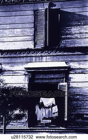 Stock Image - Laundry Hanging In Window. Fotosearch