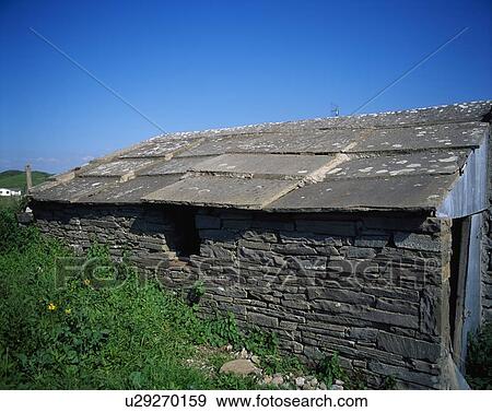Stock Photo - Liscannor, Co Clare, Ireland; Traditional Irish Cottage With A Slated Roof. Fotosearch