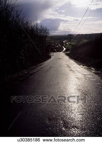 Stock Photograph - Moynalty, Co Meath, Ireland; Country Road After Rain. Fotosearch