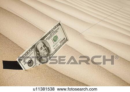 100 dollar bill in sand View Large Photo Image Stock Photo - 100 dollar bill in sand. Fotosearch