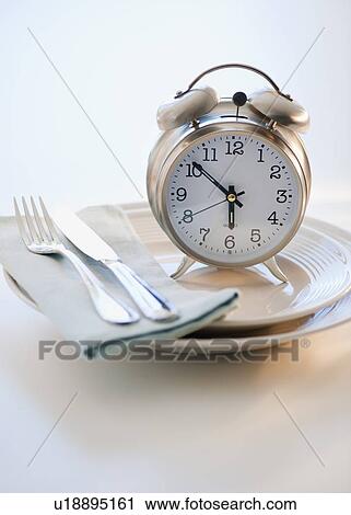 Alarm clock on plate View Large Photo Image Stock Image - Alarm clock on plate. Fotosearch