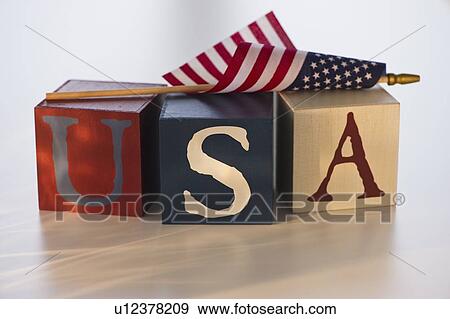 Stock Photo - American flag on wooden blocks. Fotosearch
