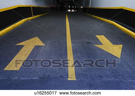Stock Photo - Arrows on road in garage. Fotosearch