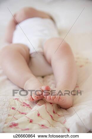 Baby lying down View Large Photo Image Picture - Baby lying down. Fotosearch