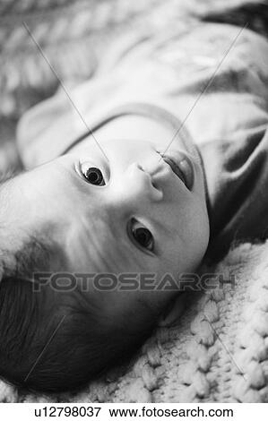 Stock Photo - Baby lying down. Fotosearch