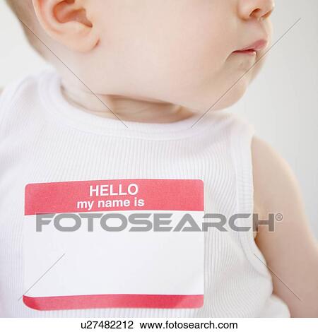 Stock Image - Baby wearing name tag. Fotosearch