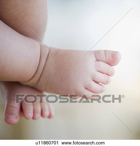 Stock Image - Baby's feet. Fotosearch