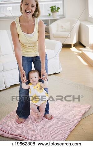 Stock Photo - Baby's first steps. Fotosearch